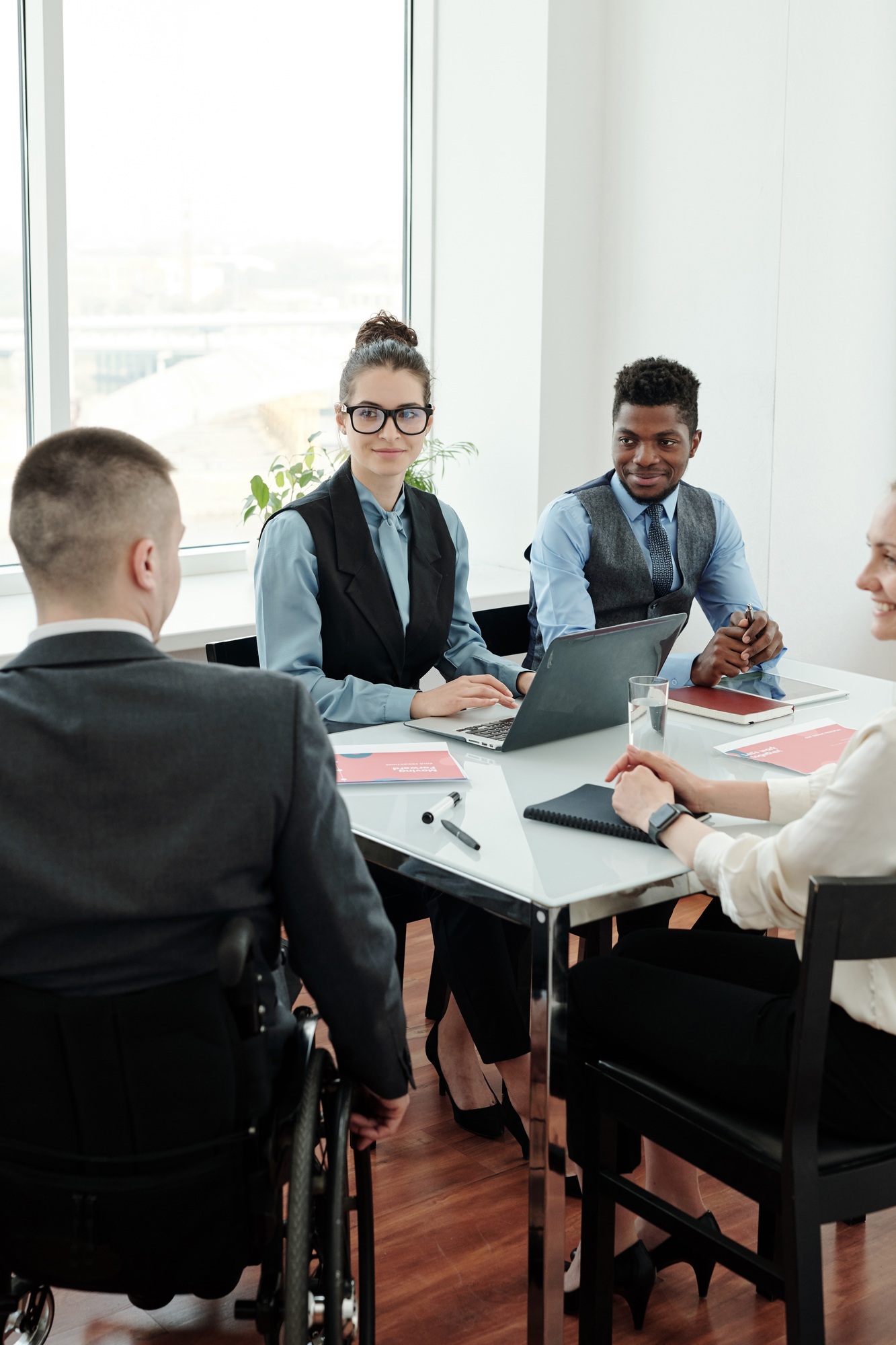 Group of managers looking at business coach